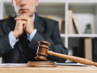 wooden judge gavel table front lawyer scaled