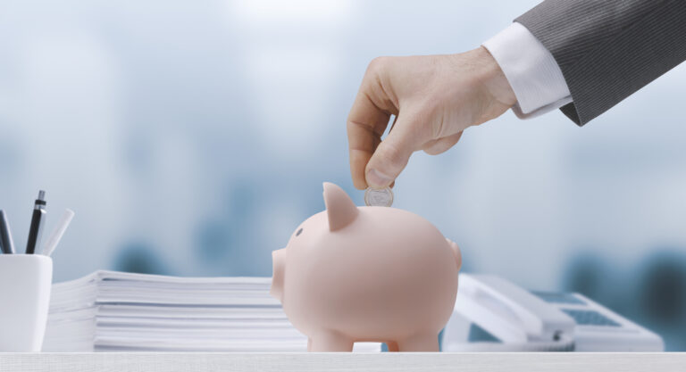 businessman inserting money in a piggy bank 2023 11 27 05 27 56 utc